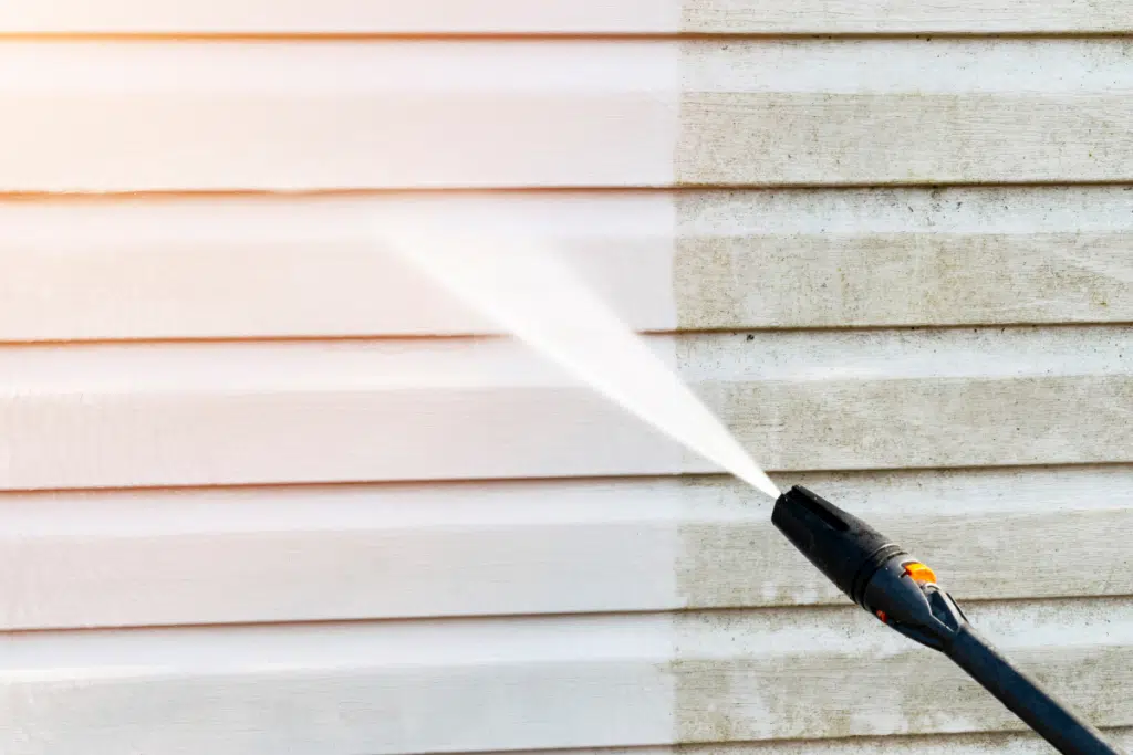 Mildew being washed away from soft washing