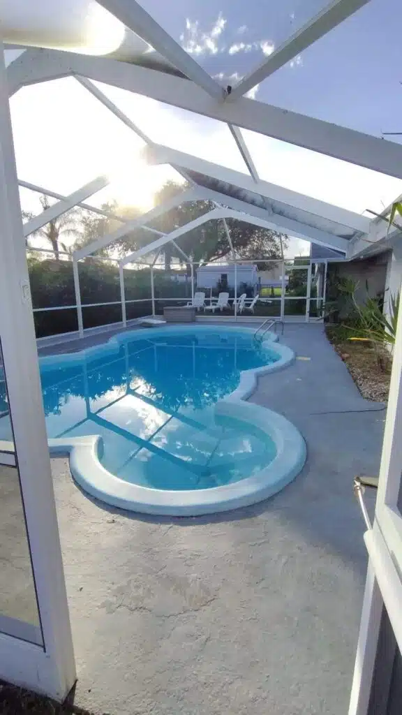 Enclosed pool with clear blue water